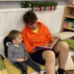 We have had the pleasure of Iestyn joining us for work experience - here he is sharing his love of literacy with a child.